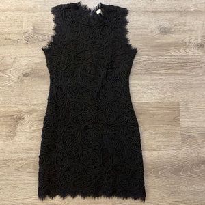 Black sheath cocktail dress with textured pattern